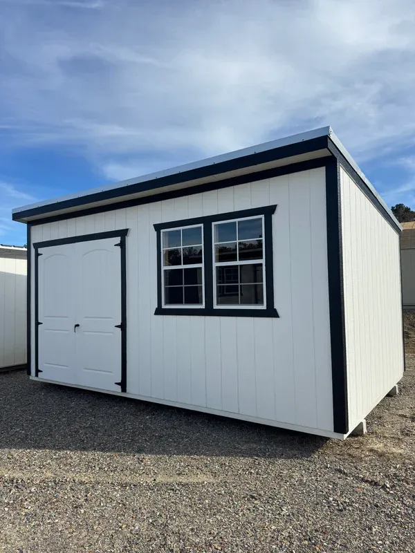 White cottage-style building with dark trim